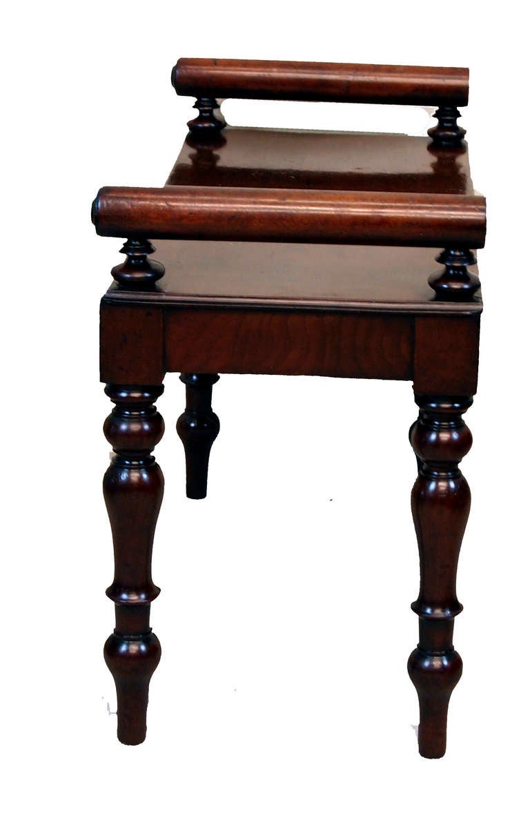 An Unusually Small Late Regency Mahogany Window Seat Hall 
Bench Having Well Figured Seat With Applied Rolls To Ends 
Raised On Elegant Turned And Tapering Legs
