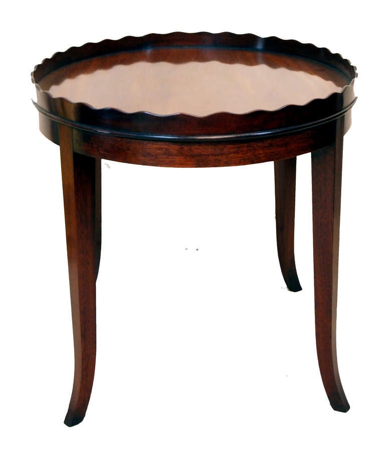 An attractive George III period mahogany oval tray having well
figured top and unusual wavy gallery housed on later square
leg mahogany stand.