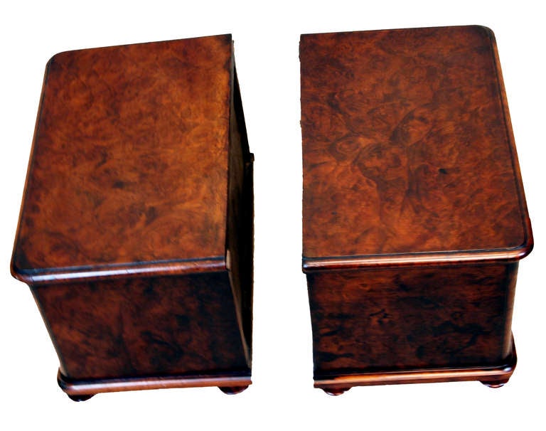 A pair of late 19th century burr walnut miniature chests of 
drawers each with well figured top above two long drawers 
with original turned knobs.

(These items would almost certainly have started life on the 
top of a large desk which has