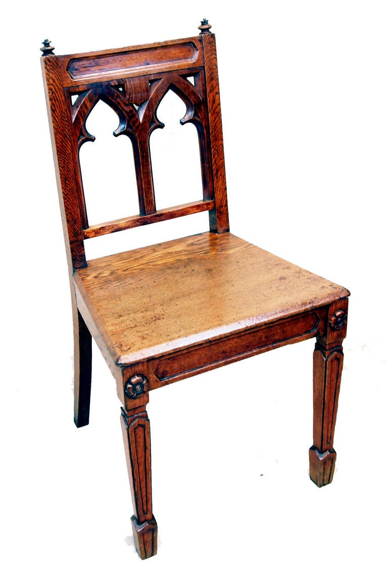 A delightful and very attractive set of six oak mid 19th century 
Chairs having unusual gothic design to pierced backs raised on 
Elegant moulded square tapering legs headed by carved patrae.