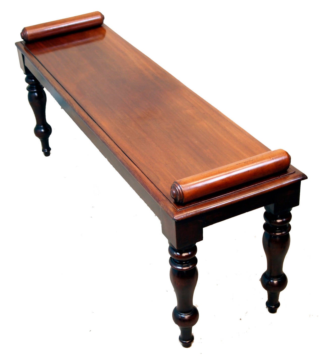 A Very Good Quality Mid 19th Century Mahogany	
Window Seat, Or Hall Bench, Having Superbly	
Figured Top With Turned Rolls Raised On	
Elegant Turned Legs