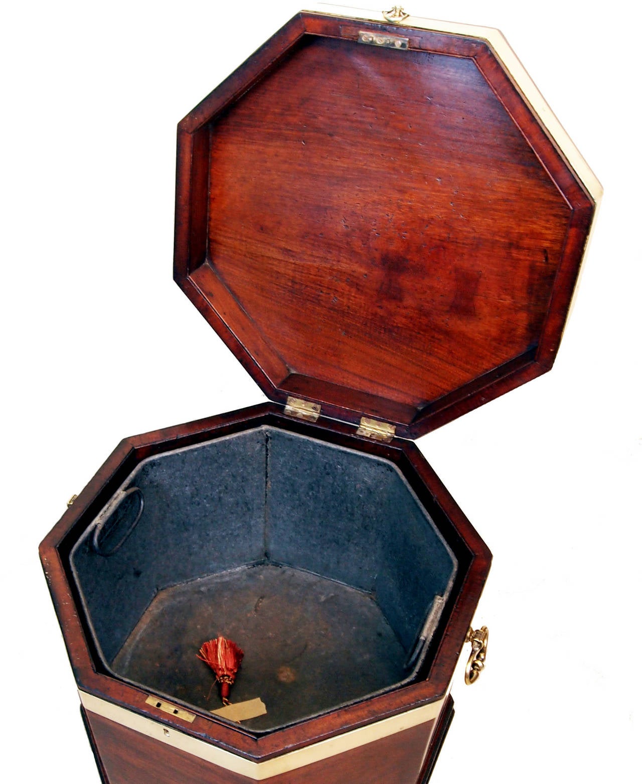 A superb quality late 18th century mahogany octagonal wine
cooler having lift up lid to reveal liner and original brass wear throughout
raised on original square leg stand with attractive
fluted decoration to frieze.