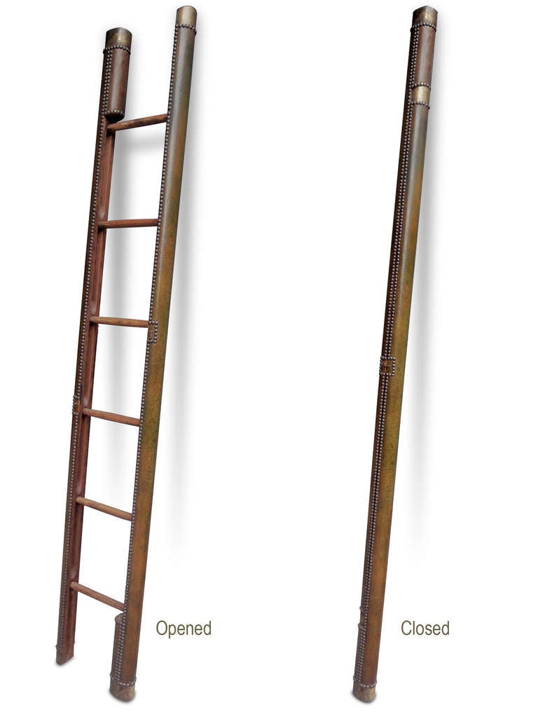 A green leather & buttoned library-ladder.

Measurements opened: 13 x 79.52 x 2.75 in.
Measurements closed: 5.50 x 89.76 x 2.75 in.