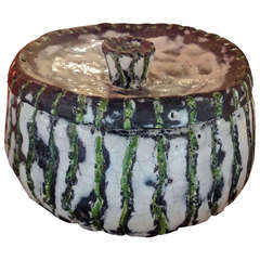 A Round Black and White Ceramic Box
