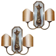 A pair of  bronze wall-lights.