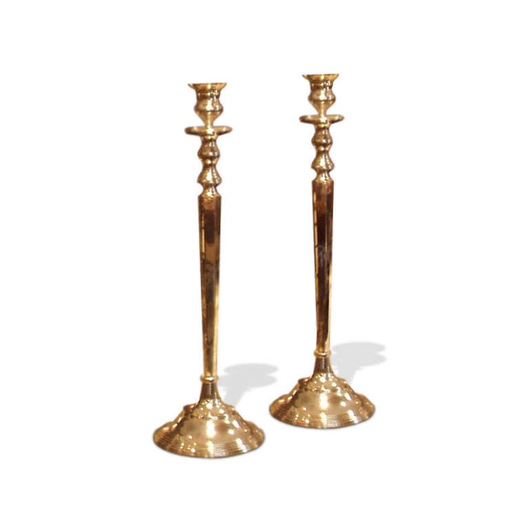 A pair of large 1940s silvered-metal candleholders.