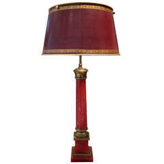 A red table-lamp by Pierre Lotier