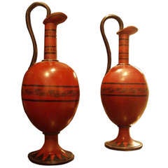 A Pair Of Red Painted Jugs