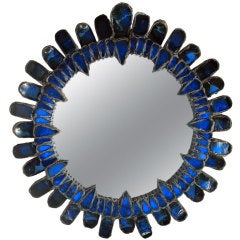 Blue convex mirror by Line Vautrin