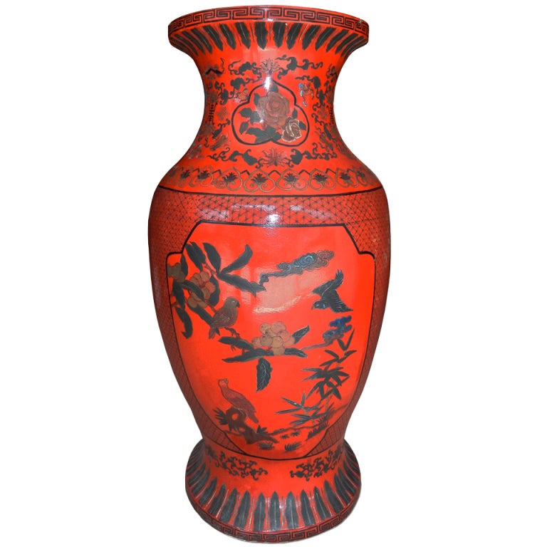 A large red-lacquered vase