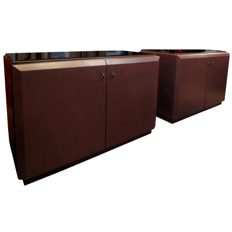 A pair of leather uphostered sideboards