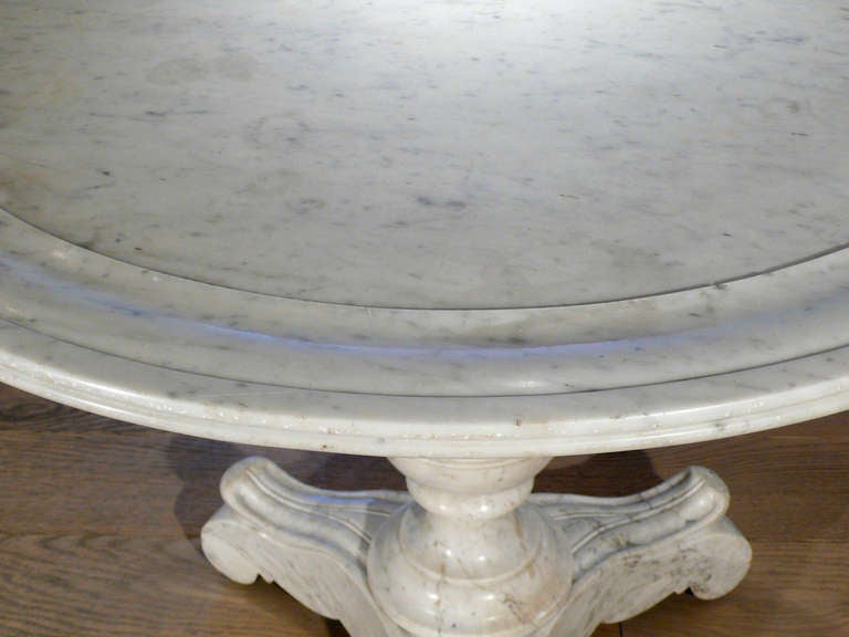 An elegant white marble table on casters c. 1830, France.