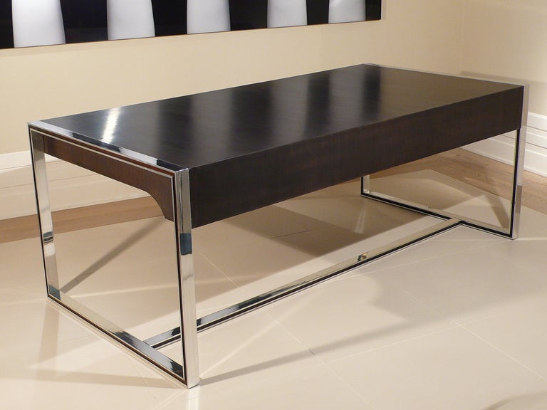 A two drawer desk in ebonised wood and polished aluminium by Claude Gaillard for la Ligne Roset, France. c.1970