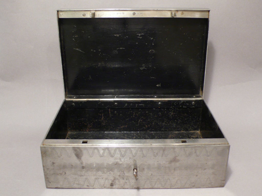 A Steel Safe Box With Engraved Geometric Decorations