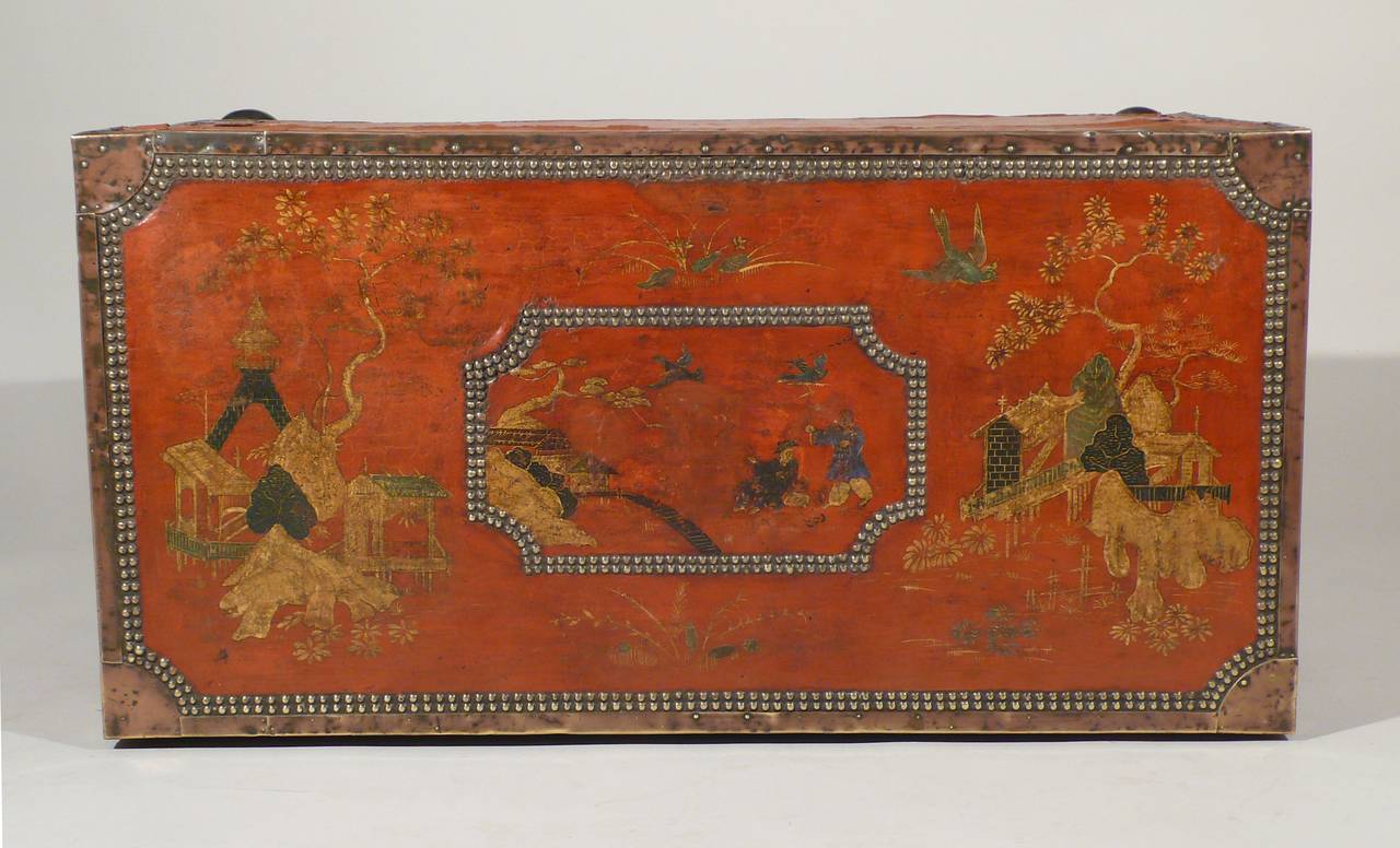 A rare Canton export red leather chest in camphor wood, with painted chinoiserie decorations , brass ornaments  circa 1800, China.
