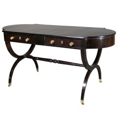 A Regnecy Ebonised Sofa-table