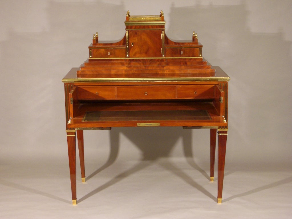 A fine mahogany desk with brass and bronze mounts, interior green leather, Late 18th century, Russia.