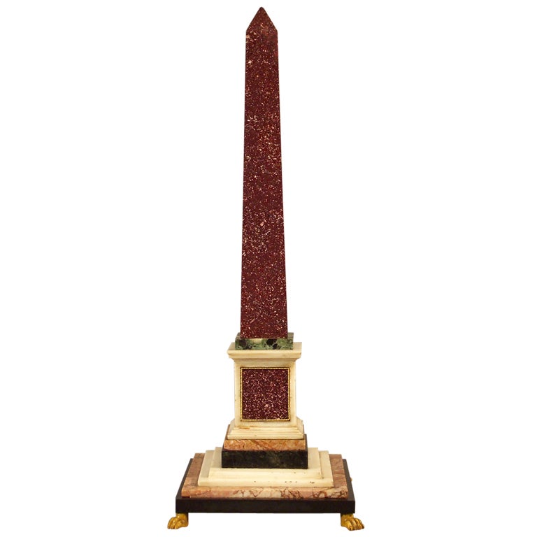 A Grand Tour Porphyry Obelisk With Sienna Marble Paw Feet For Sale