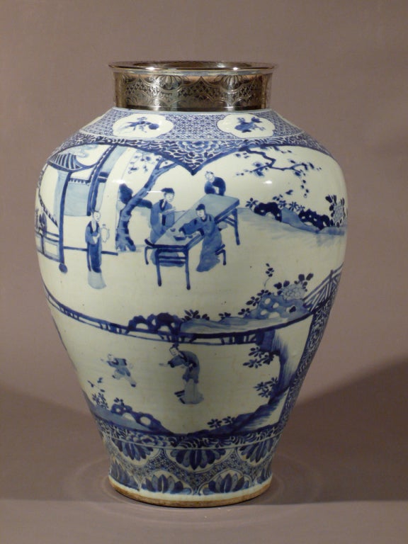 A large 18th century  Kangxi blue and white porcelain vase, mounted in silver in Brussels in the early 20th century.