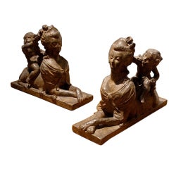 Pair of Terra Cotta Sphinxes with Burned Patina