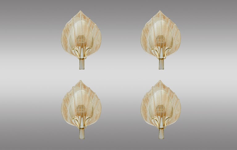 Four-leaf sconces in Murano glass with gold highlights. May sell two pieces.