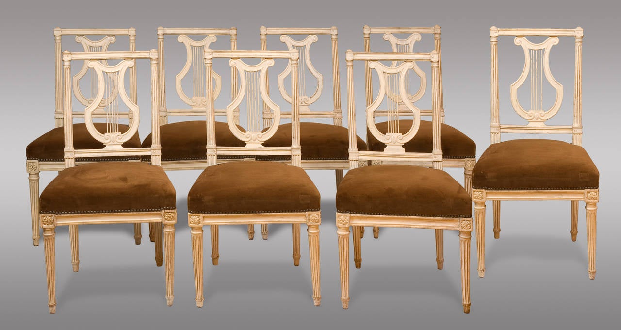 Set of eight Louis XVI period chairs. Five stamped by Gautron. Upholstered in light brown velvet.