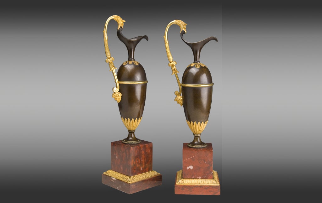 French pair of jars in gilded and patinated bronze on a marble base red Campan.
Model of A. Ravrio,
Early 19th century.