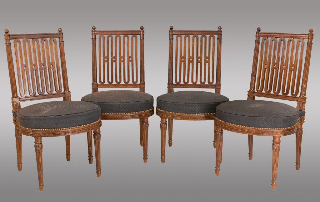 Ten Louis XVI style mahogany chairs of extraordinary quality .
Six nineteenth century and four later copies. The chairs have a large size.