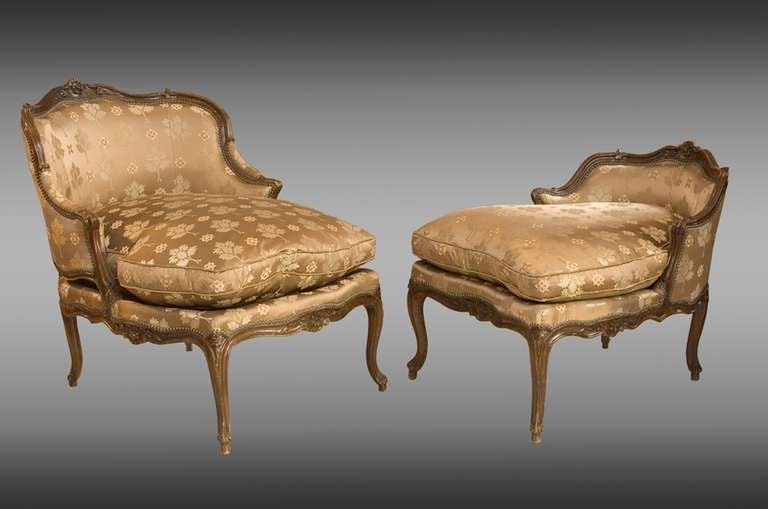 A French Louis XV, carved walnut, Duchesse Brissée. With floral decorations and cabriole legs.

Armchair: 97cm. H. / 50cm. Seat H. x 109 cm. L. x 83 cm. D.
Pouf: 74 cm. H. x 60 cm. L. x 73 cm. D.