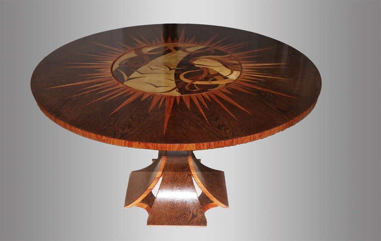 Unique table in palmwood and rosewood. Revolving centre with woman's profile and birds in various wood (palmwood, mahogany, rosewood and beechwood).