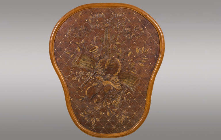 Very rare embossed leather panel. Allegory of Music and Theater. France. Nineteenth Century.