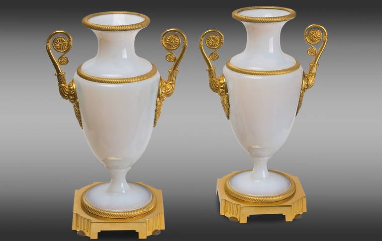 French white opaline vases with gilt bronze mounts.
Charles X Period. 
Early 19th century.
