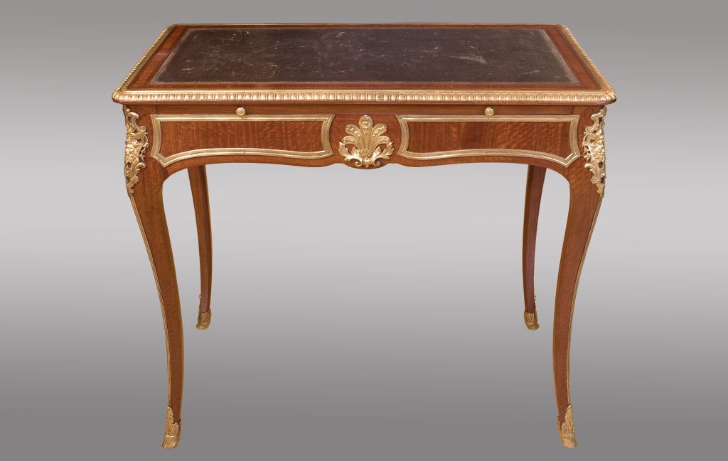 Writing table in mahogany, with two lateral drawers, leather and ormolu. Desktop support in the front. With original key.  Stamped twice G. Durand, famous 19th.century Parisian cabinetmaker.