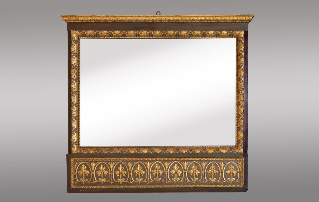 Italian neoclassical carved trumeau mirror. Cornice carved with maple leaves repeated line framing the mirror and the bottom, Tuscany, Italy.