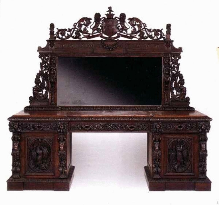 The mirrored superstructure, commissioned to commemorate the marriage of John Scott, 3rd Earl of Eldon, and Henrietta Minna Turnor in 1869, surmounted by the coat-of-arms of John Scott, 3rd Earl of Eldon, with three frieze drawers and two cupboard