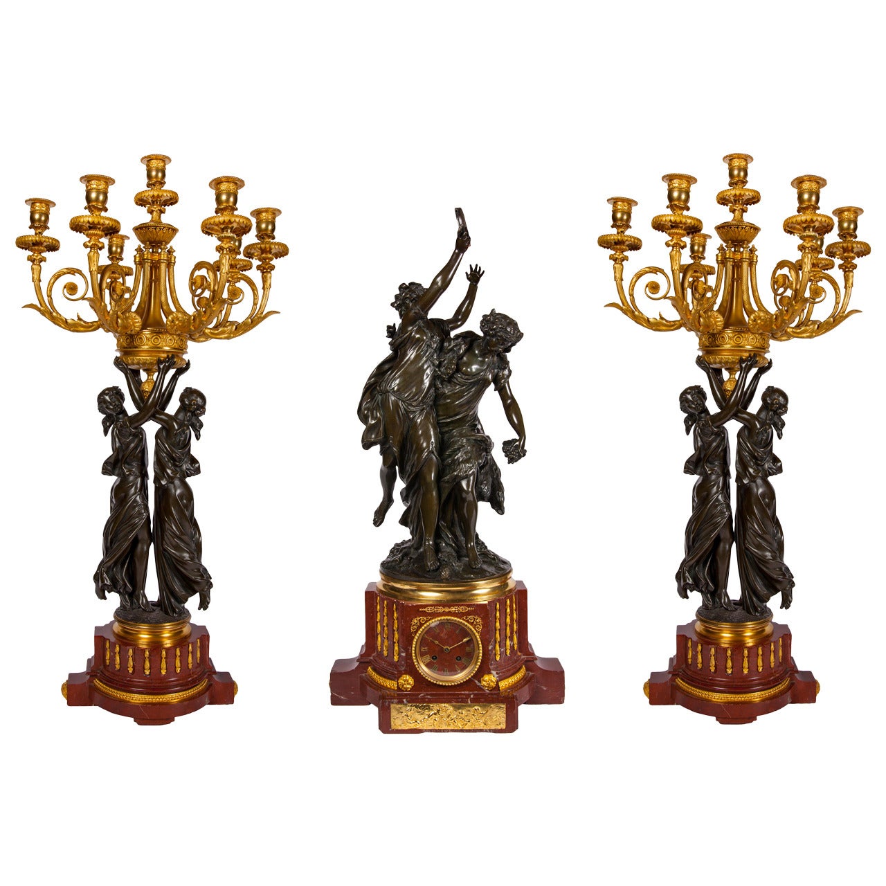 Griotte marble and gilt and patinated bronze clock garniture by Graux
French, c. 1870
Clock: Height 80cm, width 40cm, depth 33cm
Candelabra: Height 82cm, width 40cm, depth 40cmvarious

This fine three-piece set includes a mantel clock and a pair of