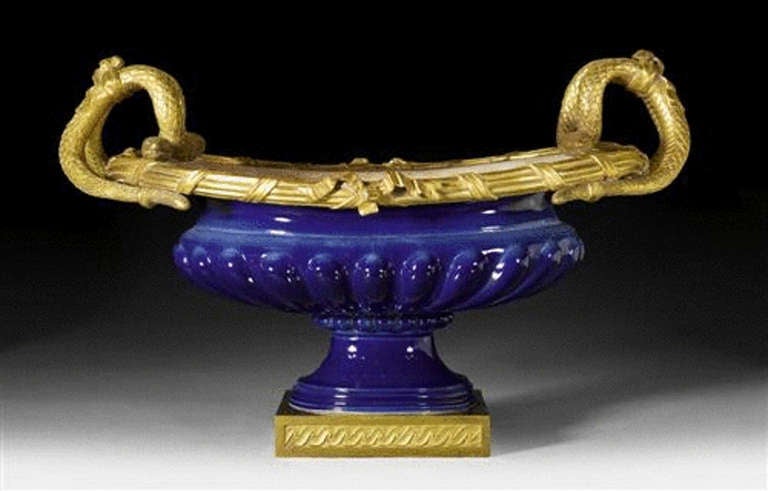 A blue porcelain jardiniere with ormolu-mounted snake handles. After Dominiques Daguerre (d. 1796. French, 19th century.)
