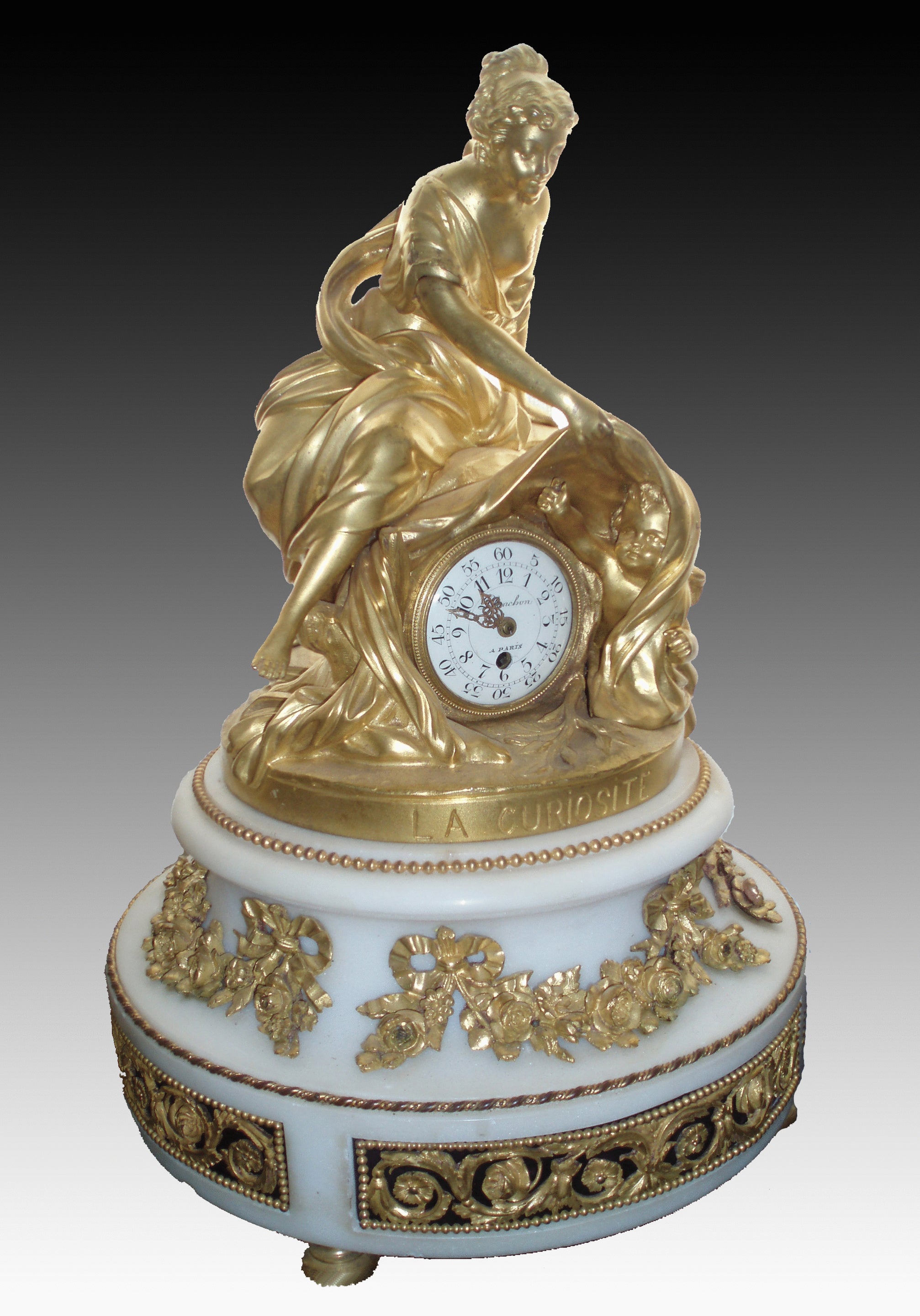 A gilt bronze and marble figural clock in the Louis XVI style