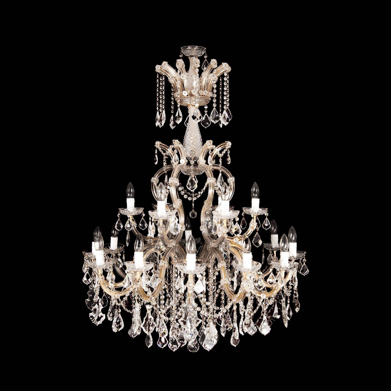 These stunning chandeliers exemplify the very finest of Bohemain glasswork. Each chandelier has eighteen individual branches of single lights with scones, which all feature hand cut teardrop shaped crystals that delicately hang below each light.