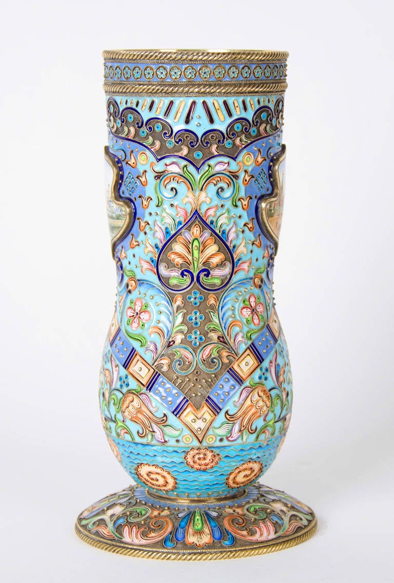 Vase intricately decorated and mounted with two enamel plaques depicting views in Russia.