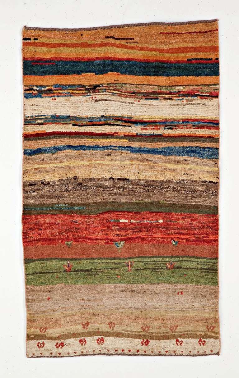 Gabbeh - a  fascinating Persian rural rug. Very powerful and colorful, with a polychromatic 