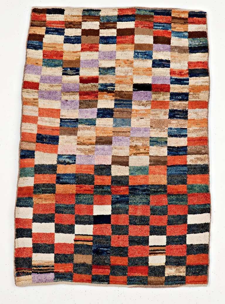 This Gabbeh rug, tribal Persian rug,  is made with extra high pile and a simple graphic design, a colorful and bright check board made with bright soft wool and emphasis on color over design detail.