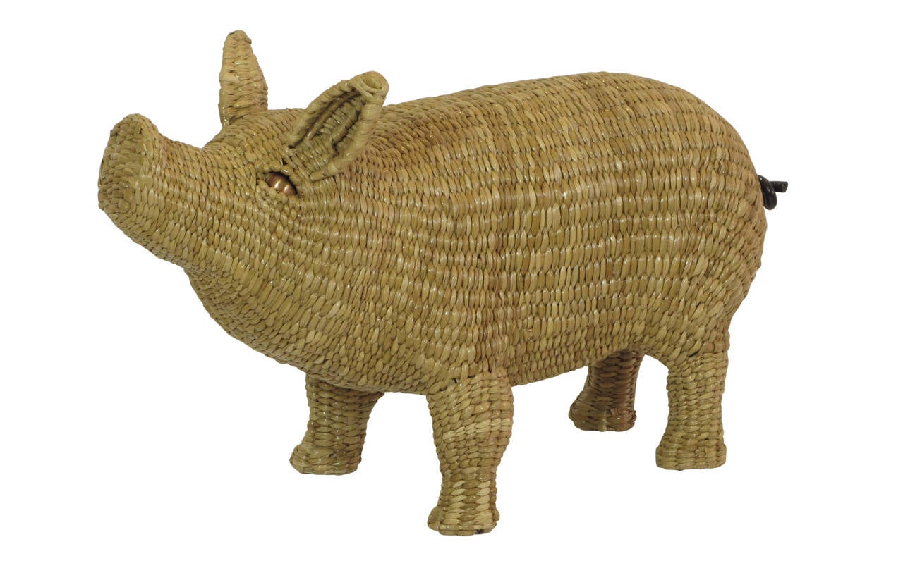 Mario Lopez Torres Wicker Pig Signed Mexico 1970's. Wicker, iron tail with copper eyes. Signed and dated on a brass medallion found on the underside chest of the pig: Mario Lopez Torres, Tzumindi, Hecho en Mexico, 1974. Lopez is a sculptor who