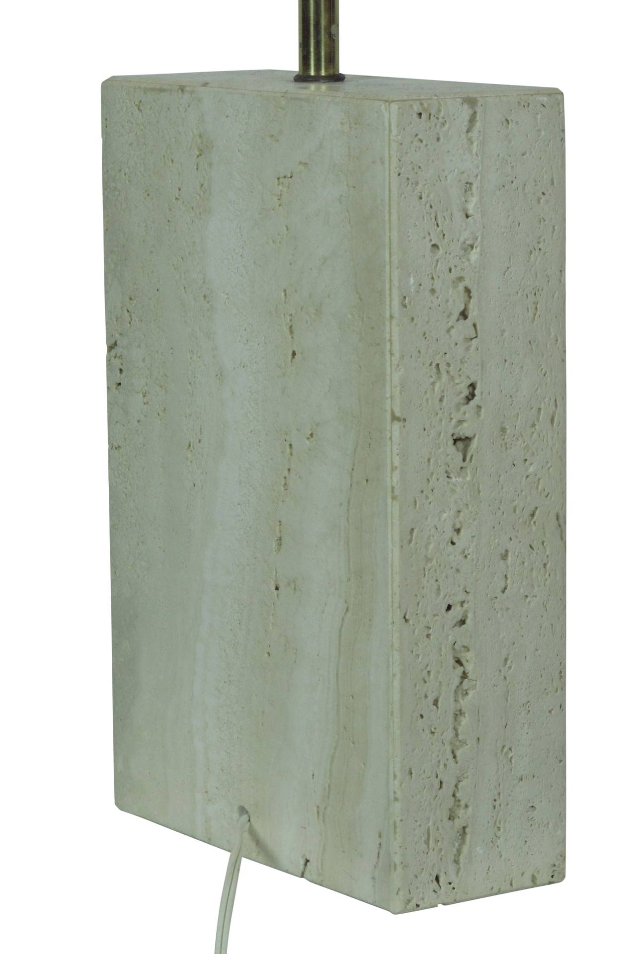 Travertine table lamp with impressed disc design. Made in Italy in the 50's and imported to United States by Raymor. Retains original socket and wiring. Will update socket and wiring to customer's specifications upon request.