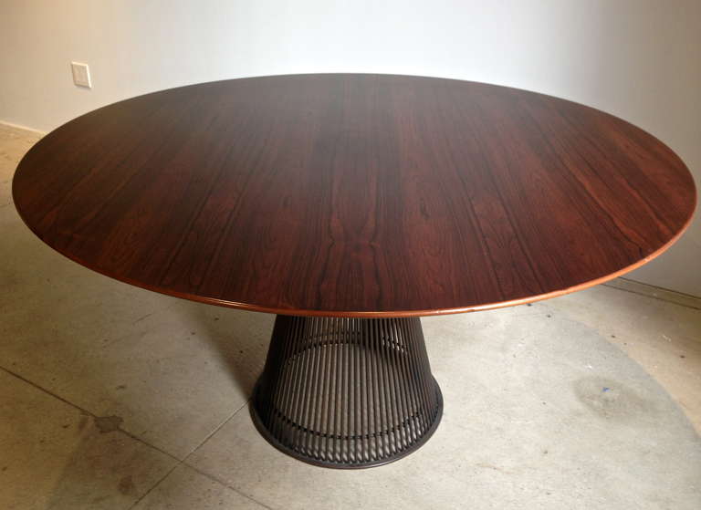 A rare bronze base and rosewood top table by Warren Platner.  Knoll produced this table  only briefly between 1968 and 1973. Retains original felt on base bottom.
