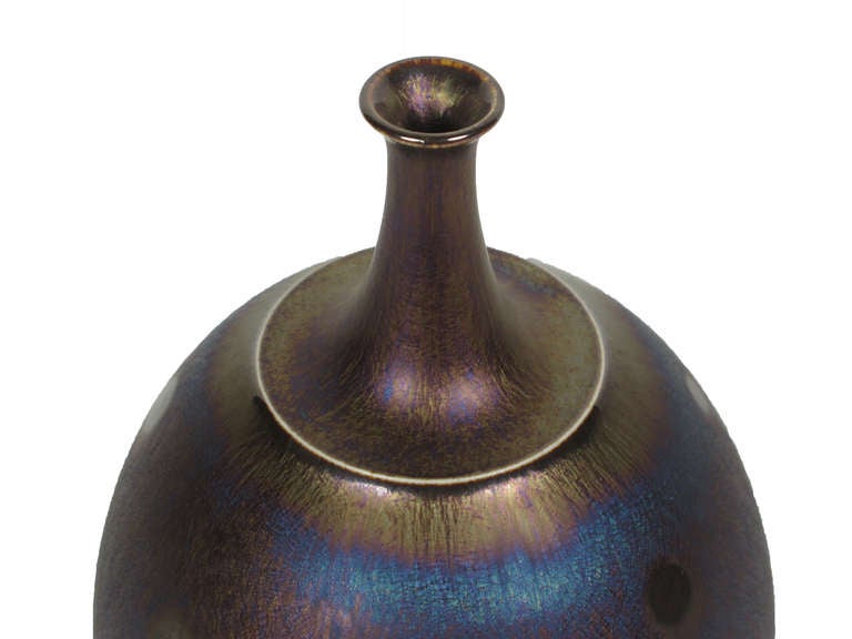 Rich iridescencent peacock Tenmoku glaze. SIgned on underside of  vase.