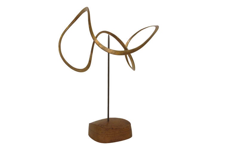 Cast bronze kinetic balance sculpture. Signed twice on bronze and wood plinth.