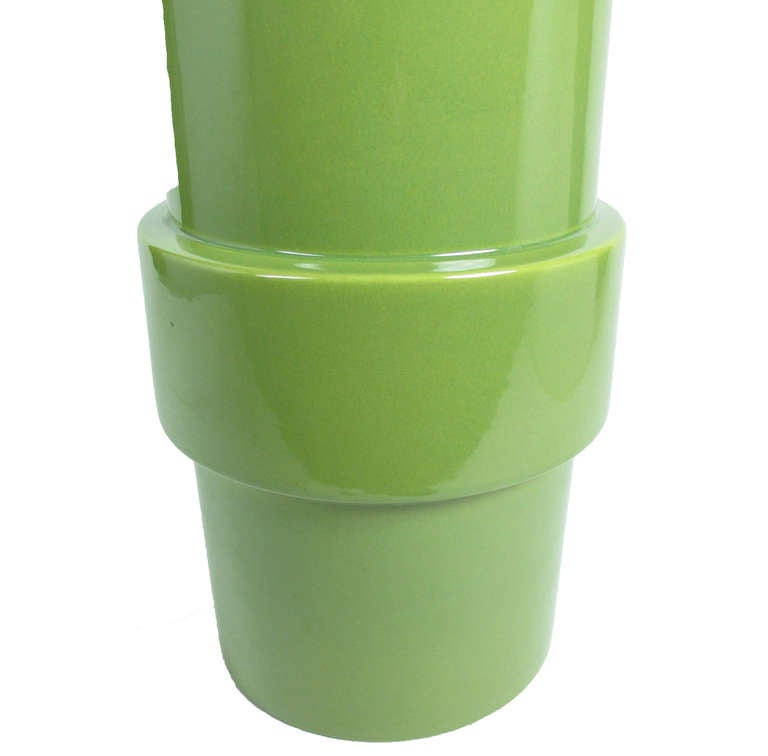 Cylindrical ceramic table lamp with a stepped broad band towards the base, in lime green glaze. Rewired for immediate use.