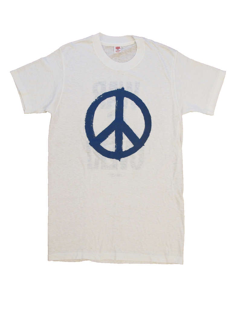 John Lennon and Yoko Ono's important message of peace and activism memorialized on this time capsule never washed, dead stock T- shirt from the early 1970's. 17 1/2