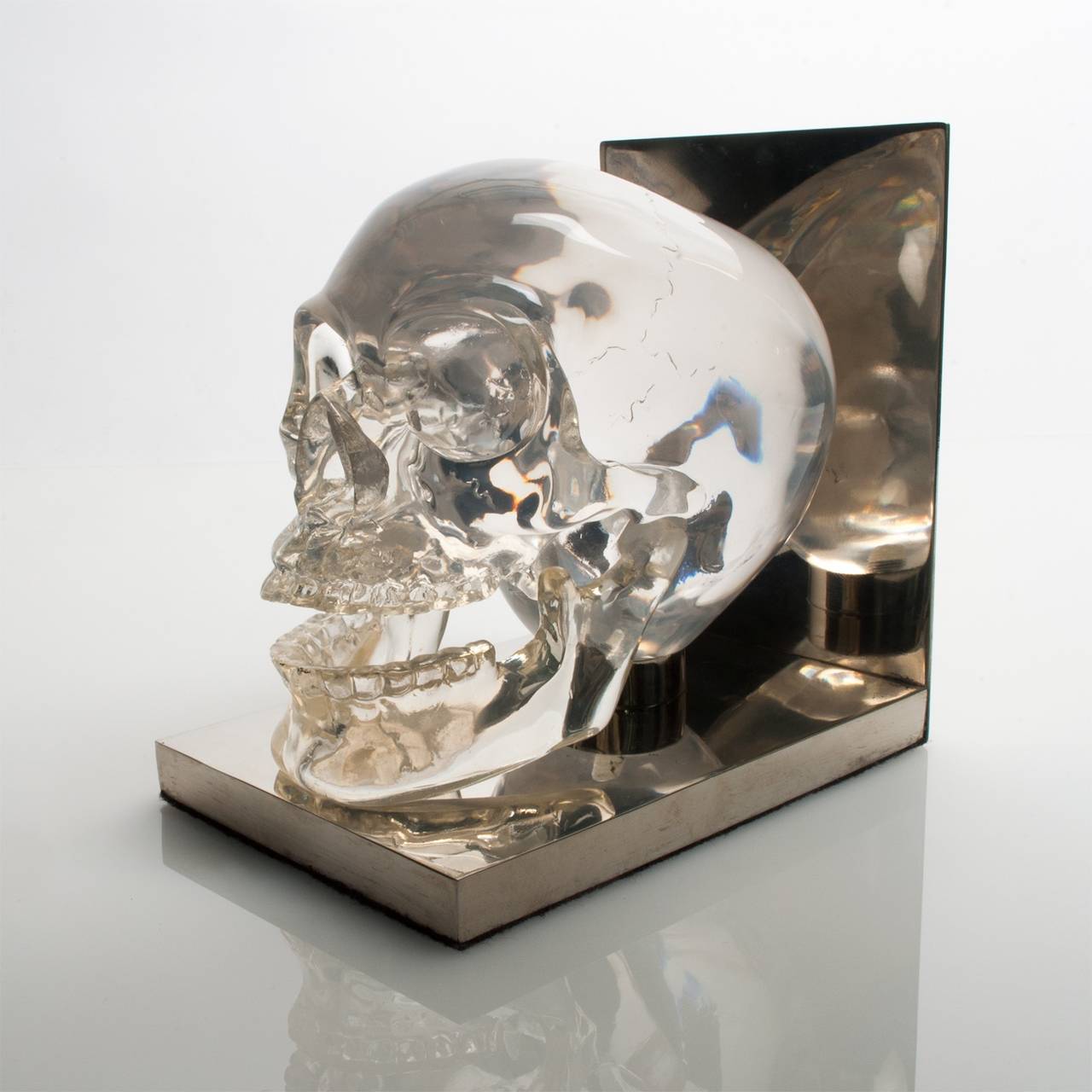 Cast Skull Bookends Acrylic Lucite Polished Steel, France, 1970s